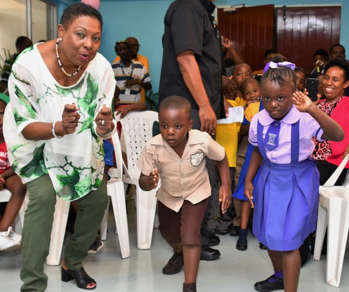 Jamaica's Sports Minister Olivia Grange shared a light moment with some of the entrants in this year’s INSPORTS Basic School Athletics Championships at the launch. The Championship will be held at the National Stadium from June 13-15.