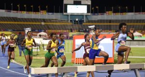 Aneisha Ingram of Edwin Allen High wins gold in the girls' Steeplechase OPEN 7:11.17 at Champs2019