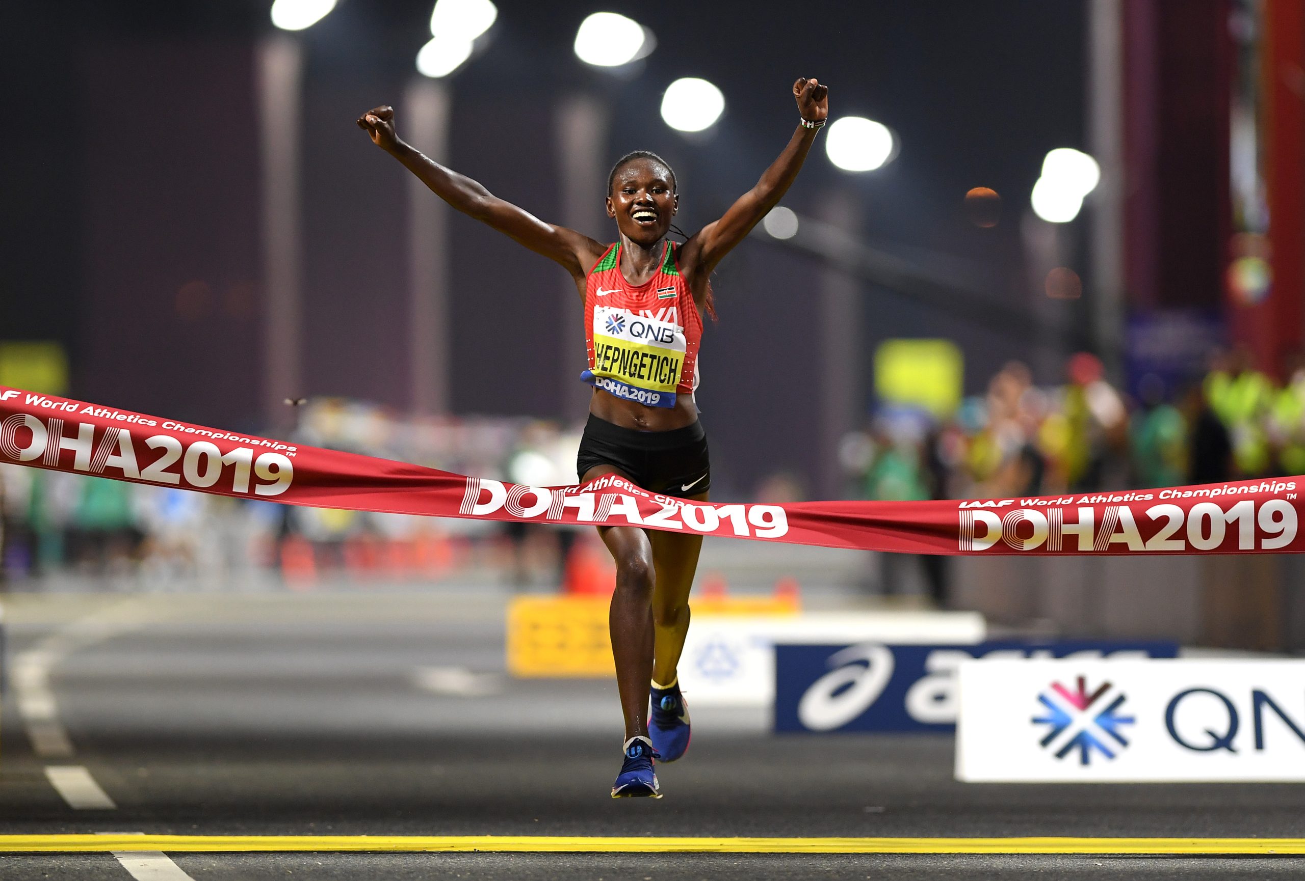 Ruth Chepngetich winning the 2019 World Athletics Championships Women's Marathon in Doha, Qatar (photo by Getty Images for World Athletics)