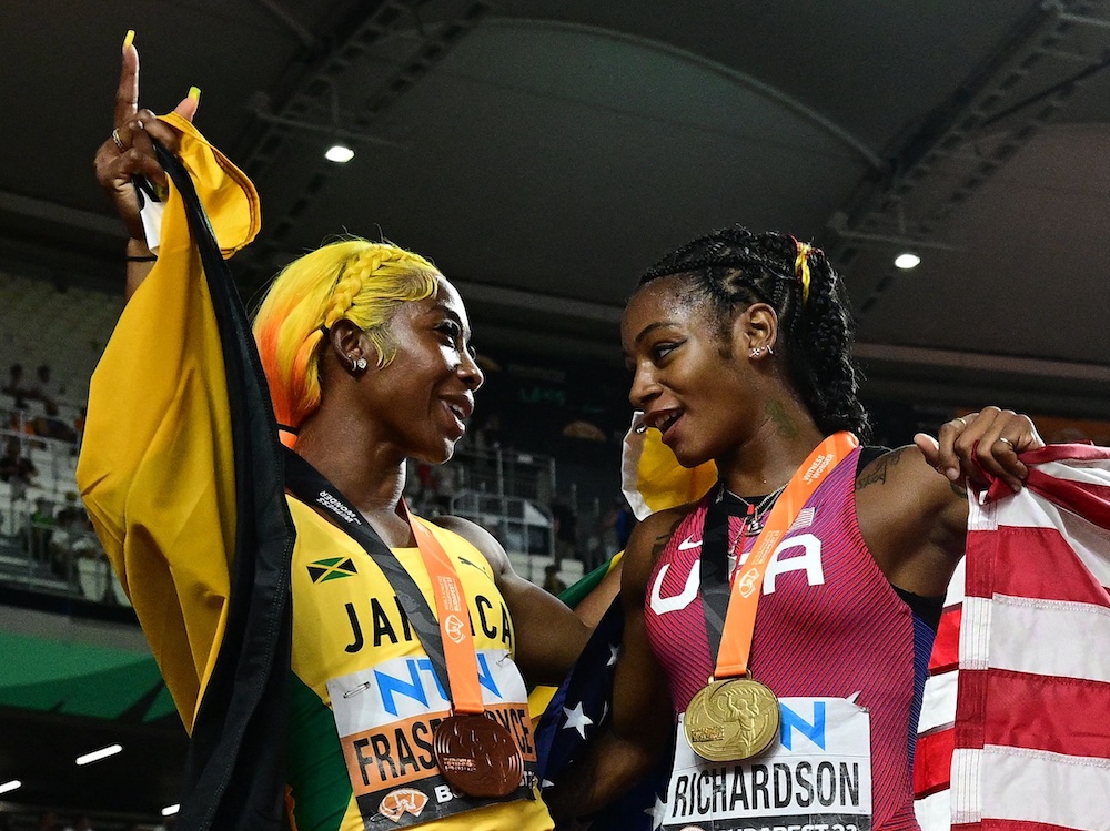 Shelly-Ann Fraser-Pryce and Sha'Carri Richardson talk after the latter's 10.65 victory at Budapest 23 World Athletics Championships