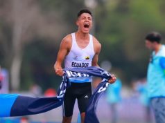 David Hurtado of Ecuador crosses the finish line, claiming gold in the 20-kilometer walk at the 2023 Santiago Pan American Games. An extraordinary triumph!
