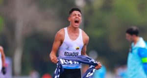 David Hurtado of Ecuador crosses the finish line, claiming gold in the 20-kilometer walk at the 2023 Santiago Pan American Games. An extraordinary triumph!