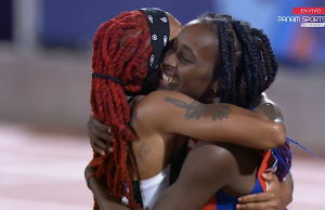 Yunisleidy De La Caridad García of Cuba and Michelle-Lee Ahye of Trinidad and Tobago after the women's 100m at at the Pan American Games